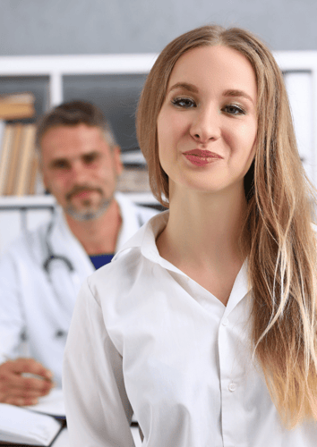Happy female patient discussing ovarian vein embolisation Happy female patient discussing ovarian vein embolisation