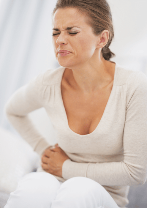 Young woman in pain suffering from pelvic congestion syndrome