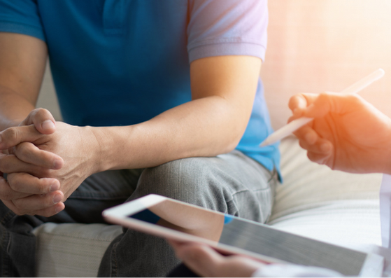 Male speaking with doctor using an iPad Male speaking with doctor using an iPad