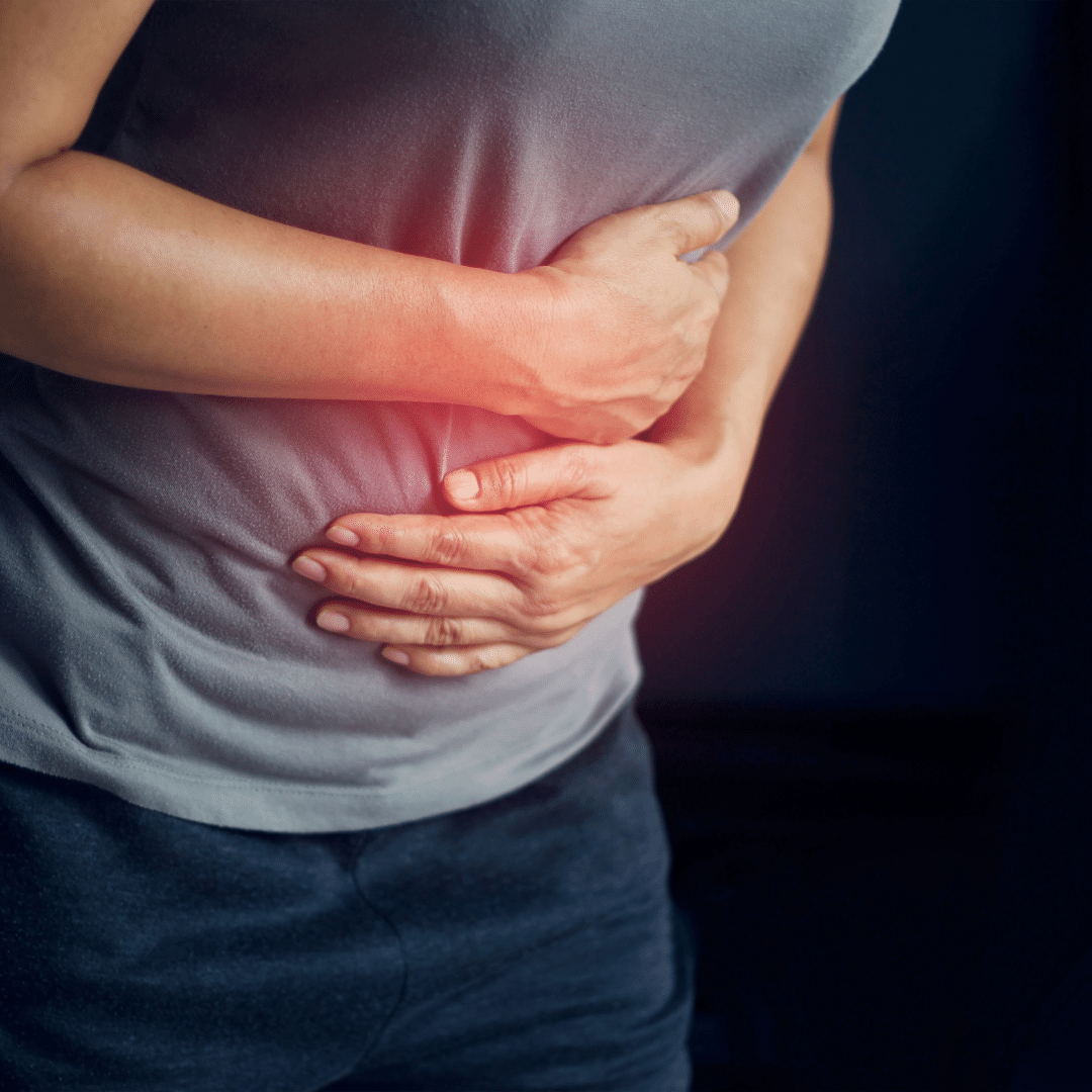 Woman suffering abdomen pain and holding stomach